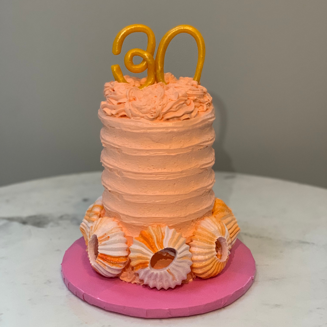 all Peach buttercream cake with meringue Sultanes and gold “30” topper.