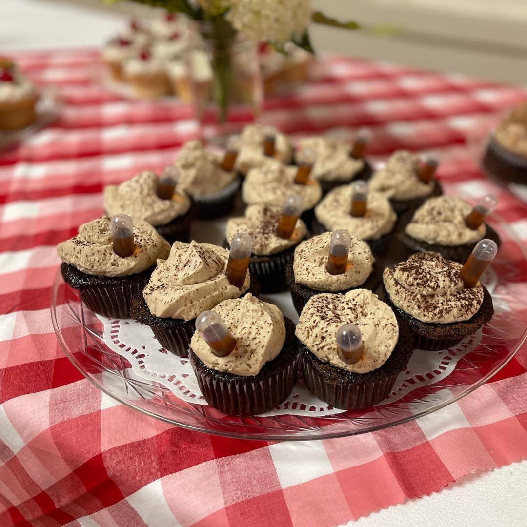 Espresso-infused cupcakes topped with creamy mascarpone-style frosting and cocoa dusting.
